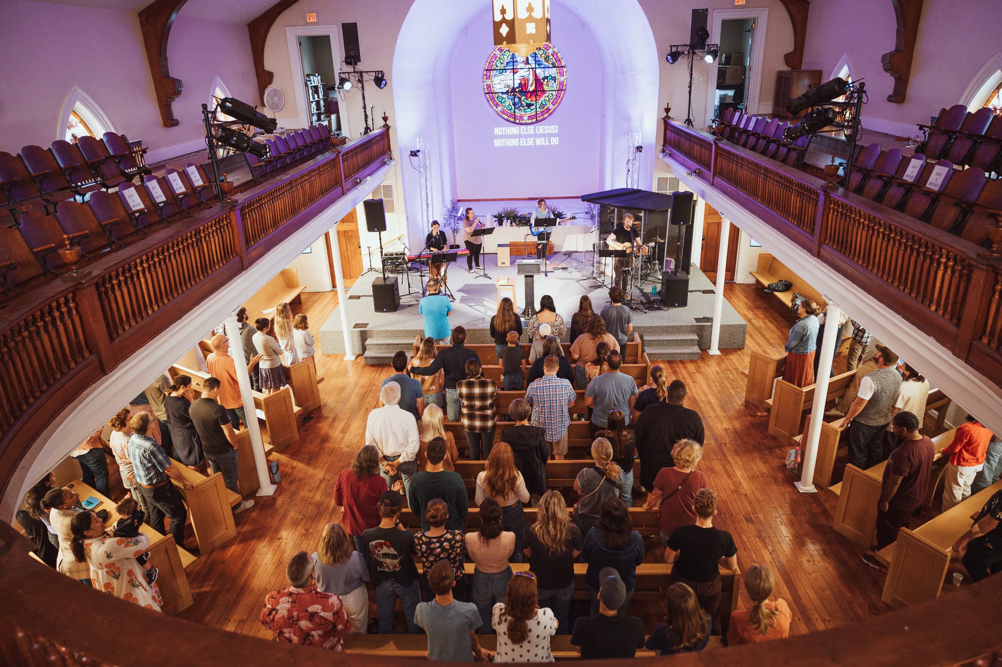 People talking over coffee at River City Church